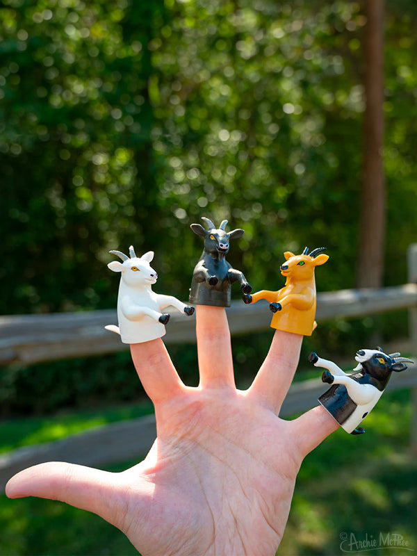 A set of small, playful finger puppets shaped like goats, with detailed facial features and soft textures, designed for interactive and imaginative play.