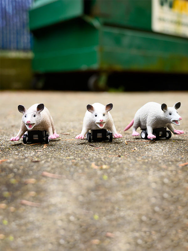 Racing possums toy featuring adorable possum figures in a playful racing pose, perfect for fun, whimsical play and adding a quirky touch to your collection.