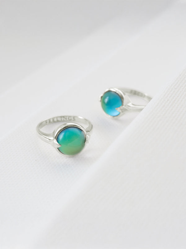 A sterling silver Feelings ring featuring a mood stone that changes color based on your emotions, offering a unique and personalized accessory that reflects your feelings.