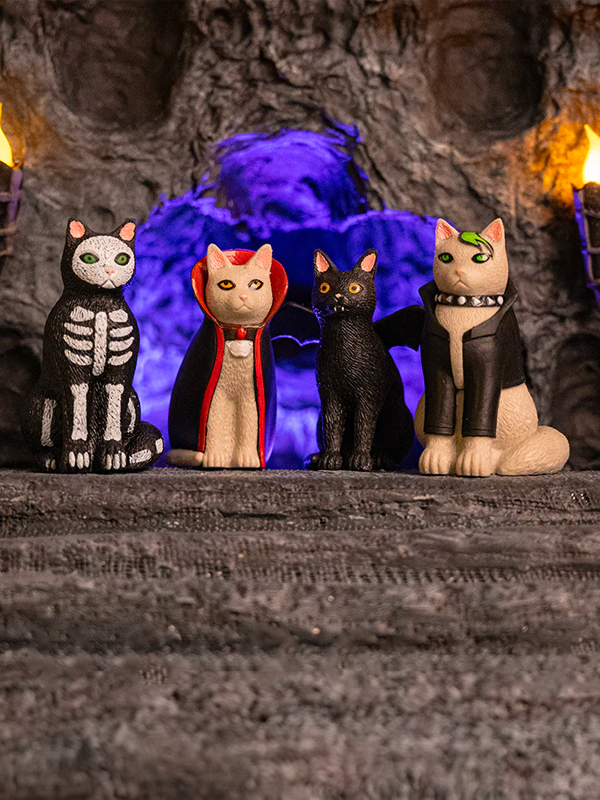A collection of goth-inspired cat figurines, each with dark, edgy details like black clothing, accessories, and a moody, mysterious expression.