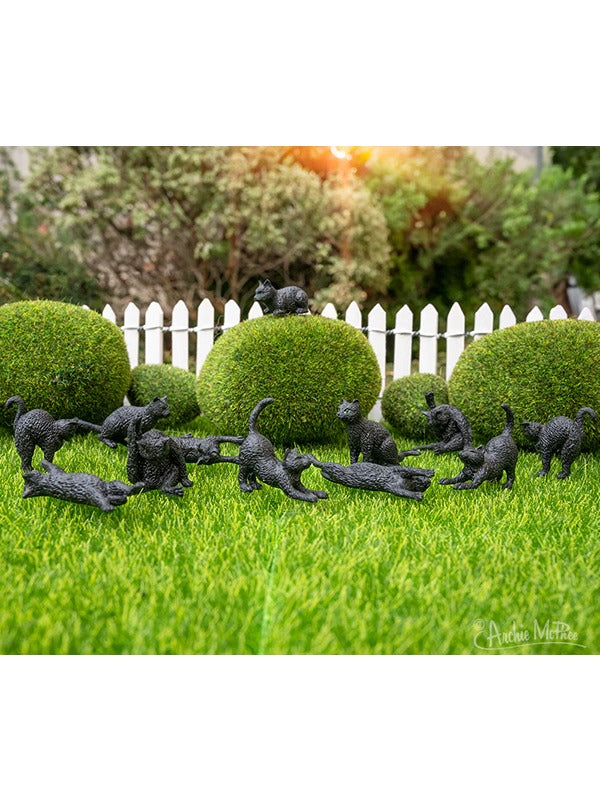 Itty Bitty Black Cats: Bag of 12 – A set of 12 miniature black cat figurines, perfect for spooky décor, collecting, or gifting. Each tiny cat showcases a sleek black finish and charming details.