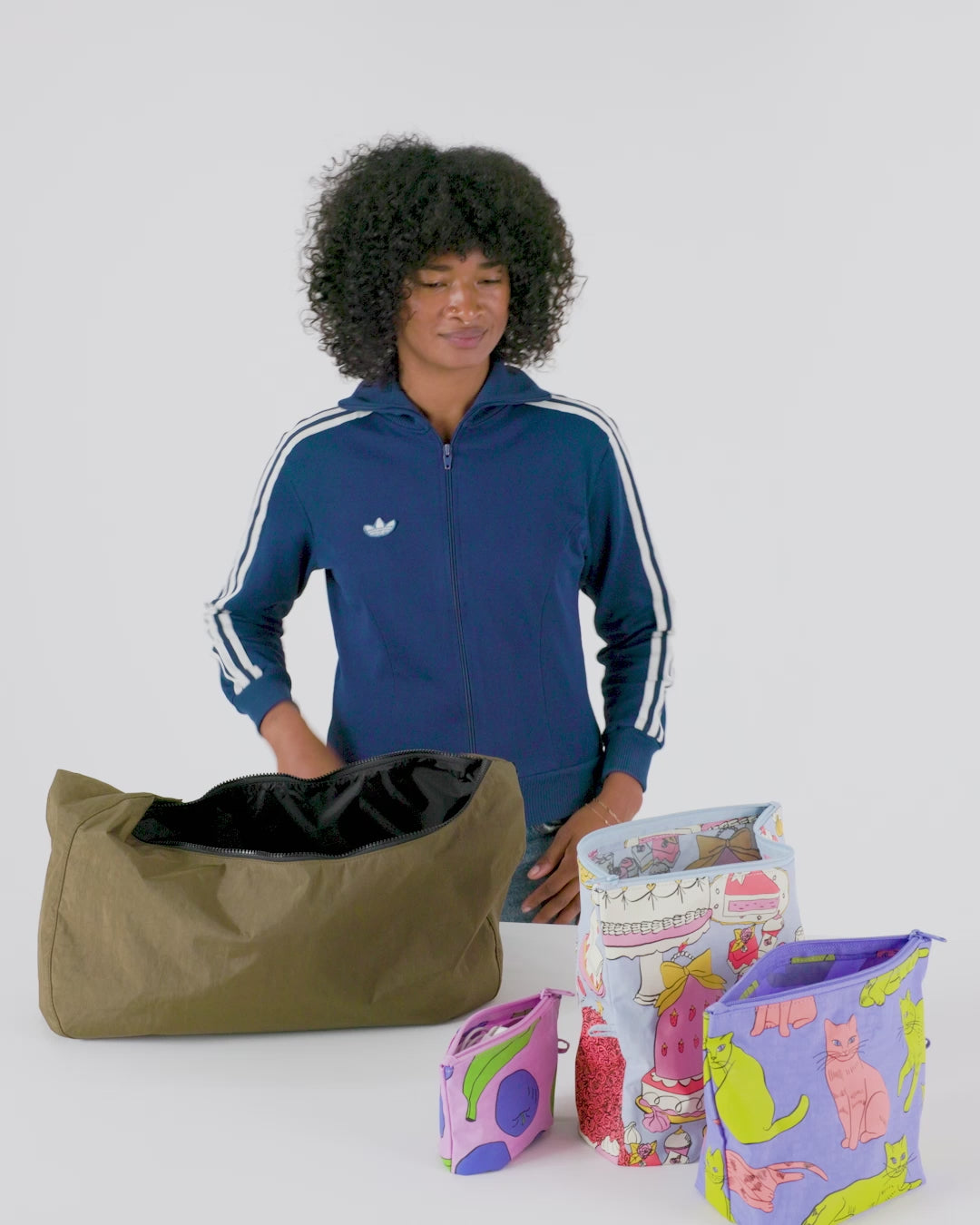 Baggu Go Pouch Set, a set of three compact, lightweight pouches in various sizes, perfect for organizing small items like toiletries, makeup, or tech accessories.